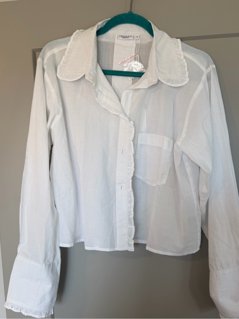NWT Chakeris button down with ruffle details